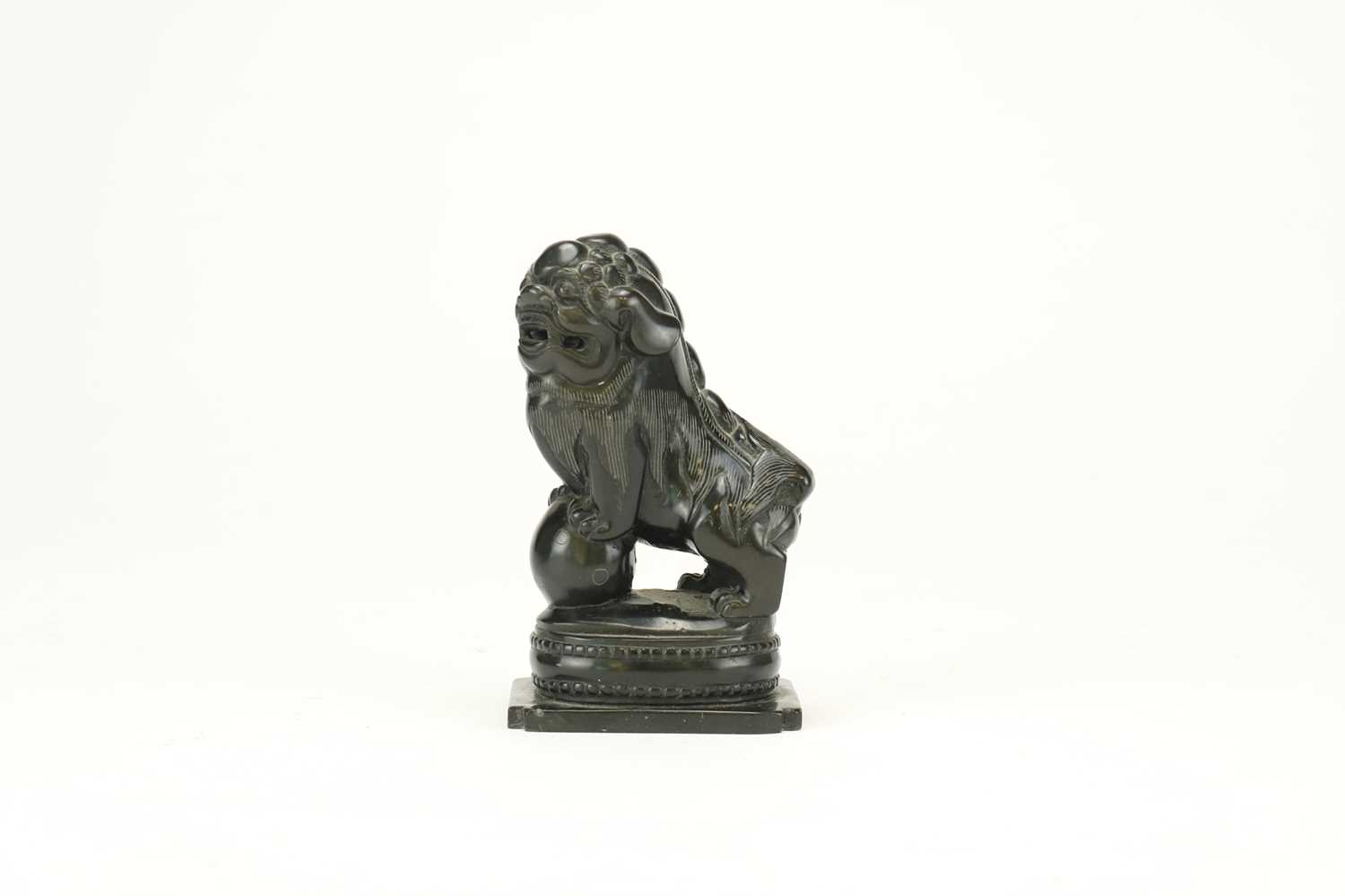 A Chinese black jade carved lion dog, Qing Dynasty