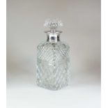 A silver mounted cut glass decanter