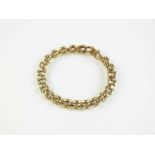 A 9ct gold three bar brick link bracelet