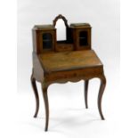 A 19th century, Louis XV style, floral marquetry bureau de dame type desk, with gilt metal mounts,