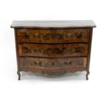 An 18th century, Italian, figured walnut veneered, serpentine three drawer commode, inlaid with