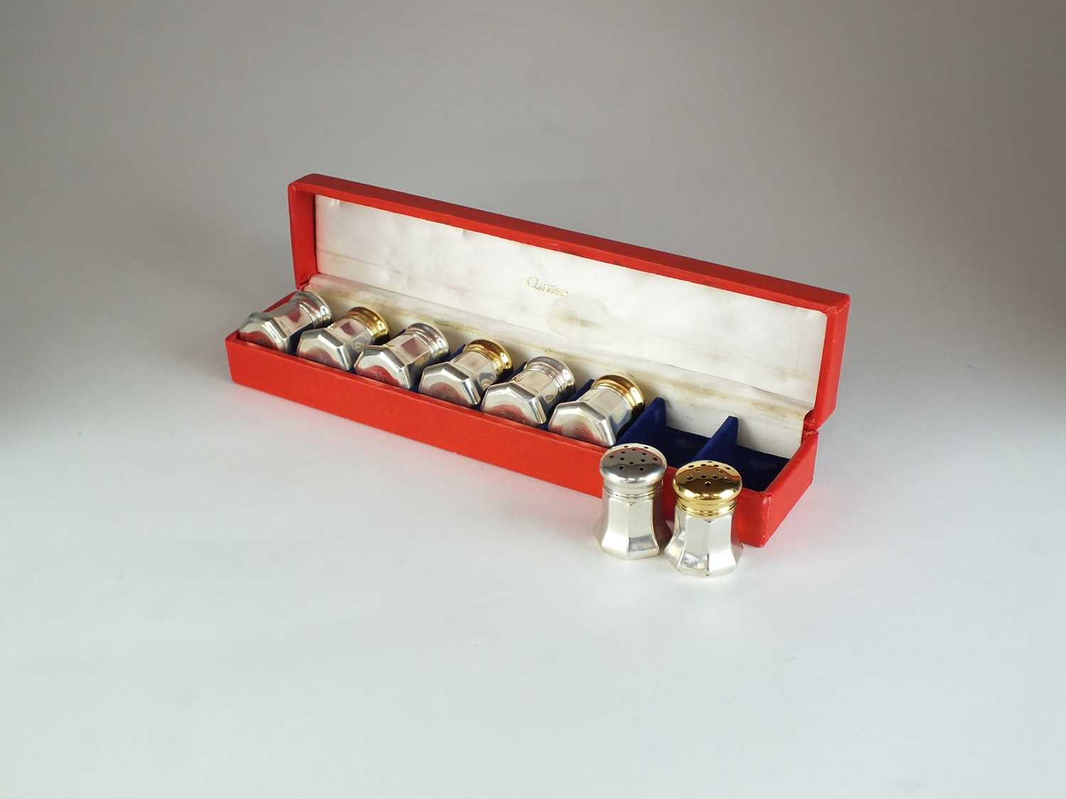 A set of silver gilt Cartier salt and pepper shakers