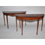 A pair of 19th century, Neoclassical style, demi-lune, satinwood console tables, painted in the