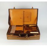 An early 20th century crocodile vanity case