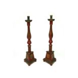 A pair of large Spanish painted wood candle holders