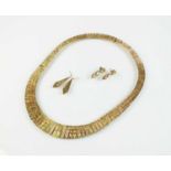 A 9ct tri-coloured gold graduated fringe necklace