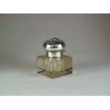 A white metal mounted cut glass inkwell