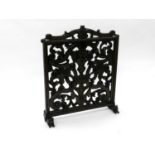 A late 19th century, Renaissance style, pitch pine and oak firescreen, carved and pierced with vases
