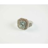 An Art Deco style 18ct white gold aquamarine and diamond cluster ring