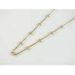 An 18ct gold diamond set necklace