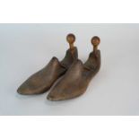 A pair of hinged treen shoe rests / cobbler's models.