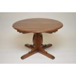 A 20th century Ercol extending dining table, 75cm high, the top measuring 114cm diameter (closed)