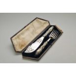 A cased pair of 19th century silver handled fish servers