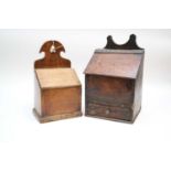 Two Welsh oak candle boxes, the largest measuring 39cm high, 24 x 20cm, the smaller measuring 36cm