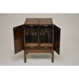 A two-sectional early 20th century oak 'Mellophone Record Cabinet', patent number 156966,