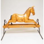 A good quality mid-late 20th century rocking horse, with horsehair mane and tail and glass eyes,