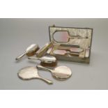 A cased silver and guilloche enamel dressing table set