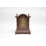 A 19th century mahogany cased mantle clock, with a brass and silvered dial with black Arabic