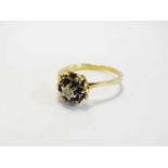 An 18ct gold sapphire and diamond ring