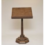 A Victorian heavy ecclesiastical oak lectern, the top with pierced motifs, over a tapering stem