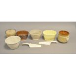 A collection of jelly moulds and ceramic kitchenalia