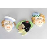 Three Art Deco wall masks