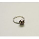 A cultured pearl and diamond ring