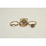 Four 9ct gold rings
