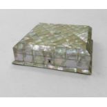A mother of pearl jewel box, of near square form with canted top and foot, the lid with a white
