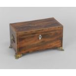 A George III inlaid mahogany tea caddy, the top inlaid with a conch shell, raised on gilt metal claw