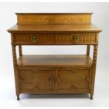 A Marple and Co. light oak buffet, first half 20th Century, with channel moulded drawers above
