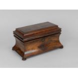 A 19th Century rosewood tea caddy, of sarcophagus form, the interior with two tea boxes flanking a