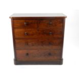 A Victorian mahogany chest of drawers, the plain top above two short and three long drawers having