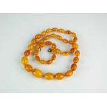 A graduated amber bead necklace