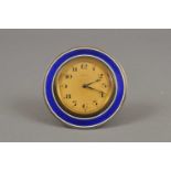 A small swiss-made Edwardian enamelled 8 day travel clock