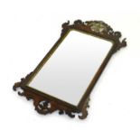 A George II walnut, open fretwork wall mirror, with typical bird cresting, 94cm high, 54cm wide