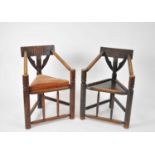 A pair of Victorian oak turners chairs, each with a chip carved back rail and supports, ring