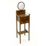 An Edwardian inlaid mahogany shaving stand, with adjustable height circular mirror above a pink