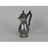 A Victorian silver hot water jug