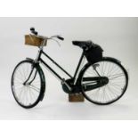 A lady's New Hudson bicycle, 21" frame in green livery, BSA three-speed gears, with wicker front