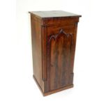 An Edwardian bedside pot cupboard, adapted from a Victorian longcase clock trunk, with gothic arched