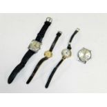 A collection of four wristwatches