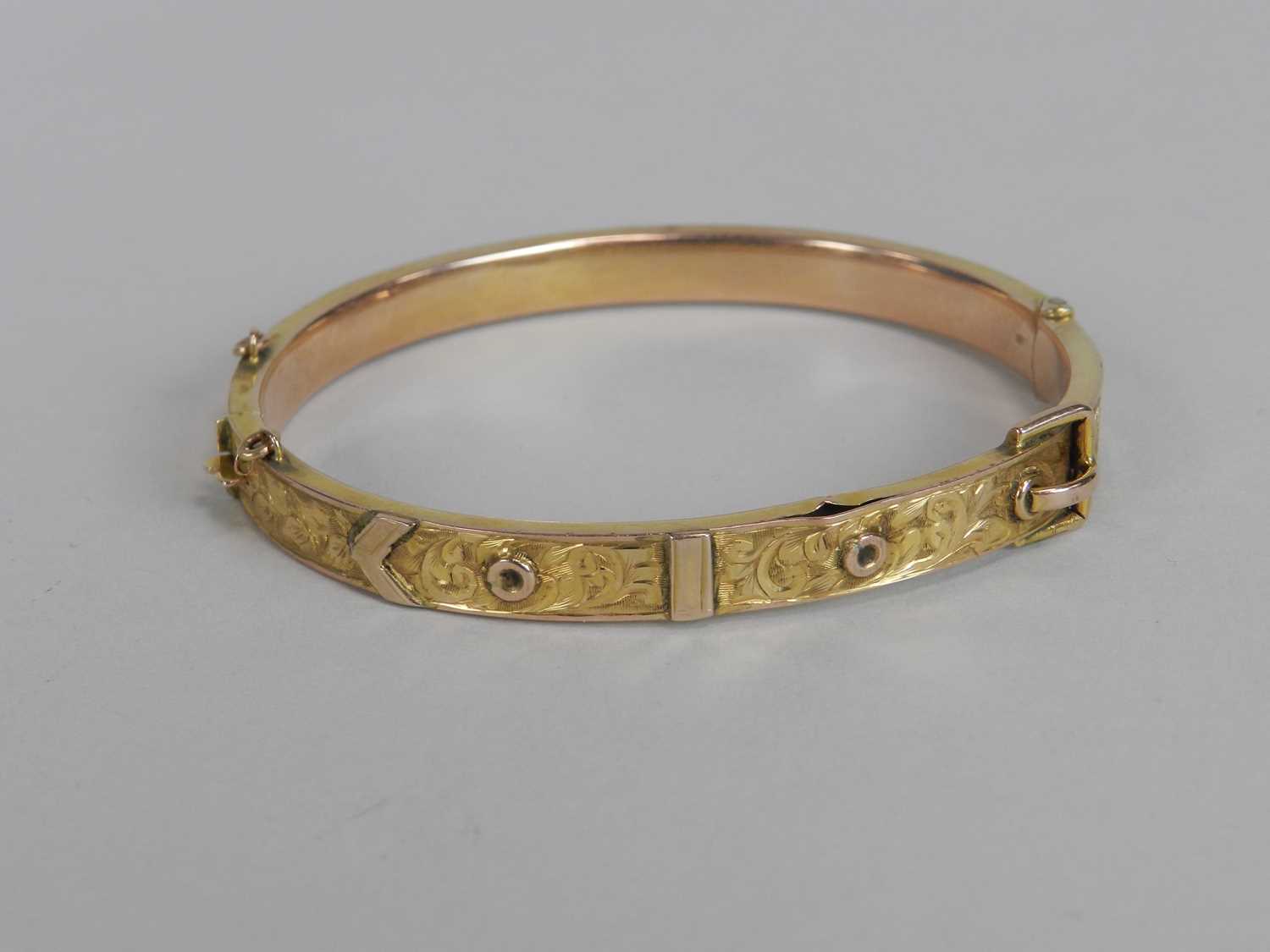 A 9ct gold buckle bangle