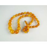 A graduated amber bead necklace,