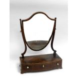 A George III boxwood strung mahogany bow front toilet mirror, the shield plate above three