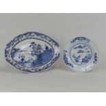 A Chinese blue and white oval dish, 18th century, of lobed form and decorated with a river scene,