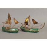 A pair of African folk art models of boats made from malachite and brass