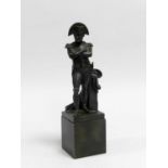 A French bronze figure of Napoleon, modelled standing beside a plinth and set on a pedestal base,