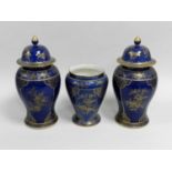 A garniture of three early 20th century vases