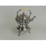A 19th century electroplated kettle on stand